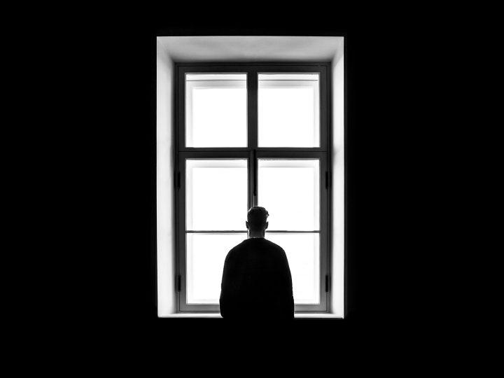 man at window
