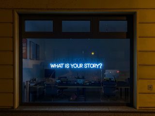 neon sign What is Your Story