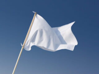 white flag flying on a pole
