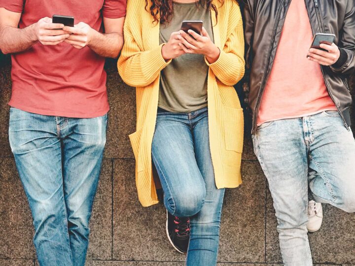 teens looking at their phones