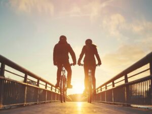 a married couple riding bicycles