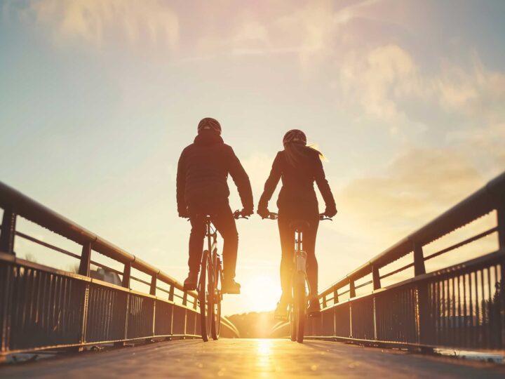 a married couple riding bicycles
